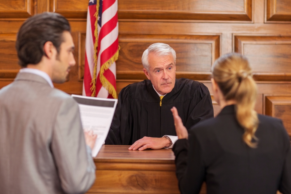 lawyers arguing at judge's bench