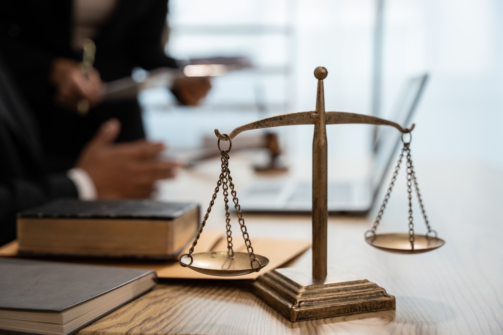 lawyers meeting, scales in foreground